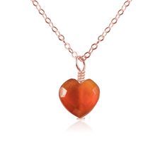 Embrace the vibrant energy of the Carnelian Crystal Heart Pendant Necklace. This pendant, with its faceted heart-shaped carnelian crystal, sparkles with a fiery, passionate glow. Carnelian, known for its invigorating and stabilising properties, fuels you with courage and creativity. The heart shape, a timeless symbol of love and connection, rests close to your own heart, deepening its emotional resonance. Crafted with love, this dainty yet sturdy necklace is perfect for daily wear, a constant reminder of the universe's magic and your unbreakable spirit. Timeless Symbol, Carnelian Crystal, Crystal Heart Pendant, Crystal Jewellery, Vibrant Energy, Crystal Meanings, Anklet Jewelry, Crystal Heart, Love Symbols