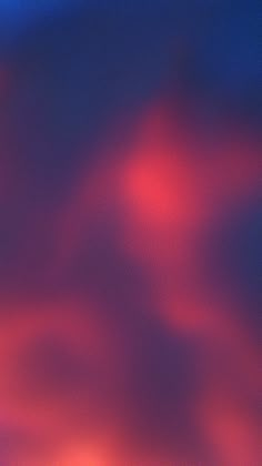 a blurry image of red and blue colors