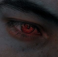 the eye of a man with red eyes