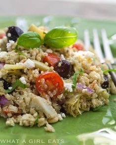 a green plate topped with rice and vegetables