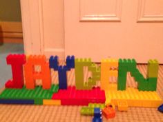 there are legos that spell out the word faith on the floor in front of a door