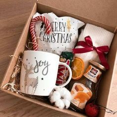 a christmas gift box filled with coffee, oranges and marshmallows