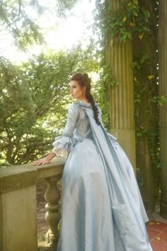 Immerse yourself in the splendor of a bygone era with our Sky Blue Rococo Ball Gown, an exquisite creation crafted for those who covet timeless elegance. This dress is a harmonious blend of the lavishness of the Rococo period and the grandeur of Baroque fashion, designed to enrobe you in a spectacle of courtly allure.The soft sky blue satin fabric drapes gracefully, cascading in sumptuous folds that reflect the light with every movement, embodying the opulent lifestyle of Marie Antoinette hersel 17th Century Dress, Marie Antoinette Dresses, French Dresses, 17th Century Clothing, 18th Century Gown, Baroque Dress, Rococo Dress, 17th Century Fashion, Antoinette Dress