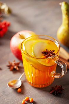 an apple cider is garnished with cinnamon, star anise and spices