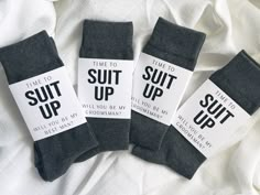 three pairs of socks that say time to suit up