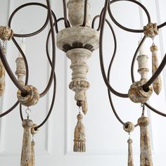 an old chandelier hanging from the ceiling