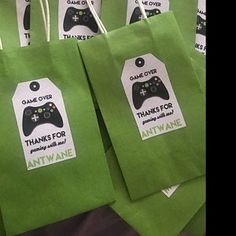 green bags with game over stickers on them