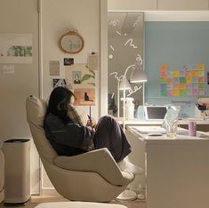 a woman sitting on a chair in an office