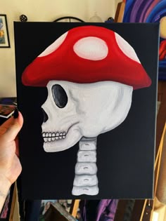 a painting of a skull with a mushroom on it's head is being held up