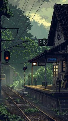 a train station in the middle of a forest