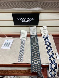 several ties are on display in a store