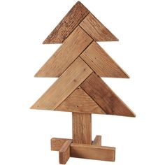 a wooden christmas tree made out of pieces of wood