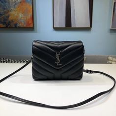 Description S.L Loulou Mini Shoulder Bag Black For Women 7in/18cm YSL Rep 1:1 Size: 14 x 18 x 7 cm / 5.5 x 7 x 3 inches (Length x Width x Height)  Loulou Mini shoulder bag from S.L is a sophisticated day-to-night companion. quilted base is treated with a combination of paper printing, which creates a full-grain finish, and a smoothing tanning process. We don’t like to pick favorites, but this design holds a special place in our hearts – and, with its timeless looks and ever-iconic YSL hardware, we predict it will have the same effect on you. Silver metal hardware Magnetic snap button fastening Interior: one main compartment, one flat pocket Grosgrain lining Includes box, dust bag. This product is of the best quality. Timeless Looks, Yves Saint Laurent Bags, Saint Laurent Bag, Shoulder Bag Black, Mini Shoulder Bag, Metal Hardware, Fashion Handbags, Ysl Bag, Snap Button