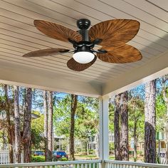 a ceiling fan on the porch of a house