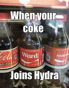 three bottles of soda sitting on top of a shelf next to each other with the words, when your coke joins hydra