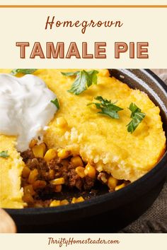 a skillet filled with corn and topped with sour cream in the background text reads, homemade tamale pie