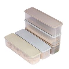 three plastic storage containers with lids stacked on top of each other and filled with food