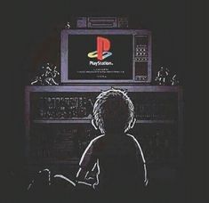 a young boy sitting in front of a computer monitor with the nintendo logo on it