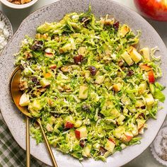 a salad with apples and cranberries in a bowl