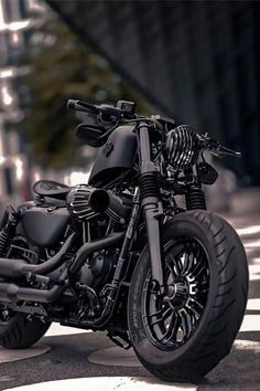 a black motorcycle is parked on the street