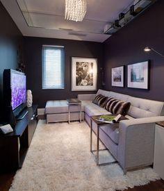 a living room filled with furniture and a flat screen tv