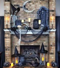 a fireplace decorated with halloween decorations and candles