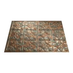 a brown floor mat with an intricate design on it