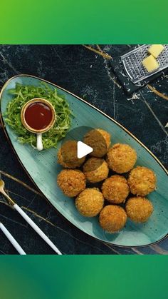 an image of food on a plate with chopsticks and sauce in the background