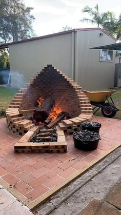 an outdoor fire pit made out of bricks