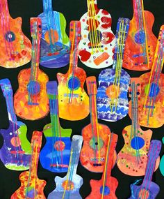 an image of colorful guitars painted on black background