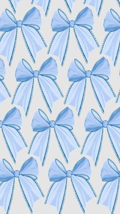 a blue bow on a white background that looks like it is made out of fabric