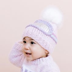 The perfect beanie for little skiers, and non-skiers alike. Our Pink ski hat featuring a Lavender, Sky Blue, and Pink goggle band is the perfect blend of warmth, comfort, and style, while the White faux fur pom-pom and silver metallic details add dimension and design to this epic beanie. Pair with our Pink Ski Sweater or Mittens for a complete look. Final design may vary slightly from the pictured mockup. Crafted with care using 100% Hand-knit Acrylic. All measurements laid flat, unstretched. If Pink Ski Goggles, Baby Skiing, Pink Knit Hat, Popping Colors, Lavender Sky, Ski Hat, Kids Beanies, Ski Sweater, Ski Hats