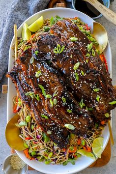 a white plate topped with meat and veggies