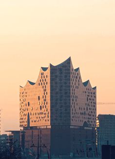 a tall building sitting in the middle of a city