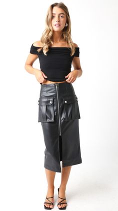 This edgy black skirt features a front zipper, slit, and cargo pockets, giving you a rebellious yet chic look. Stay on trend with this must-have addition to your wardrobe! 55% polyester, 45% PU Return Policy ALL RETURNS ARE FOR STORE CREDIT ONLY. Feel free to email us at info@shopluxxeapparel.com or DM us with any questions regarding fit, styling, or our return policy in general. To read more into our return policy please click here. Faux Leather Midi Skirt, Leather Midi Skirt, Summer Favorites, End Of Summer, Sunglasses Sale, Black Skirt, Front Zipper, Return Policy, Midi Skirt