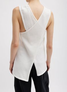 The Cotton Criss Cross Sleeveless Sweater is crafted from a Peruvian crispy lightweight cotton yarn. Available in two WOF colorways– White and Cinnamon– this sleeveless sweater will become your WOF layering best friend this season. With multiple styling options, this sweater can be paired back to the Garment Dyed Silky Cotton Sid Pant for a Chill. Modern, and Classic look. 100% Cotton Style Number: U124SC6486 Available in: Cinnamon, White Fall Outerwear, Cross Top, Sweater Sale, Denim Flares, Sweater Design, Sleeveless Sweater, Ulla Johnson, White Sweaters, Cotton Style