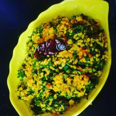 a yellow bowl filled with rice and vegetables