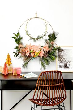 a desk with a chair and pictures on it