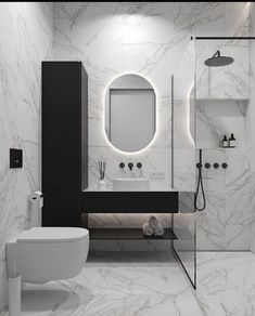 a modern bathroom with marble walls and flooring