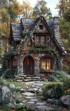 a small house with lots of windows and plants on the roof is surrounded by rocks