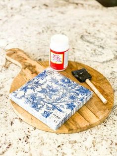 a blue and white plate with a napkin on it next to a wooden spatula