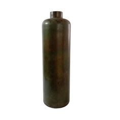 a large metal bottle sitting on top of a white surface