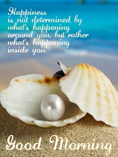 a seashell with a pearl in it on the sand next to the ocean and text happiness is not determined by what's happening around you, but rather