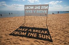 a sign on the beach that says,'take a break from the sun '