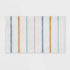 a white towel with multicolored stripes on it