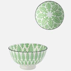 two green and white bowls sitting next to each other