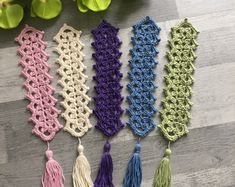 several crocheted tassels are laid out on the floor