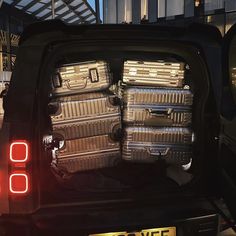 there are many suitcases in the back of this car