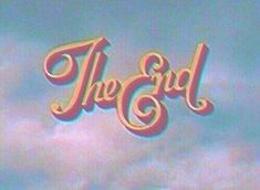 the end logo on top of a blue and pink sky with clouds in the background