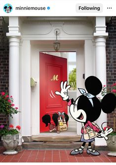 a cartoon mickey mouse standing in front of a red door